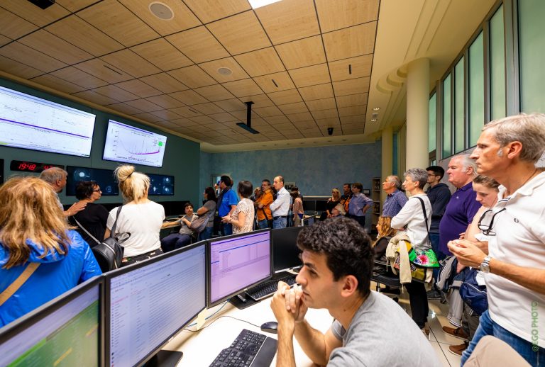 Visitors doing a guided tour inside Virgo’s control room