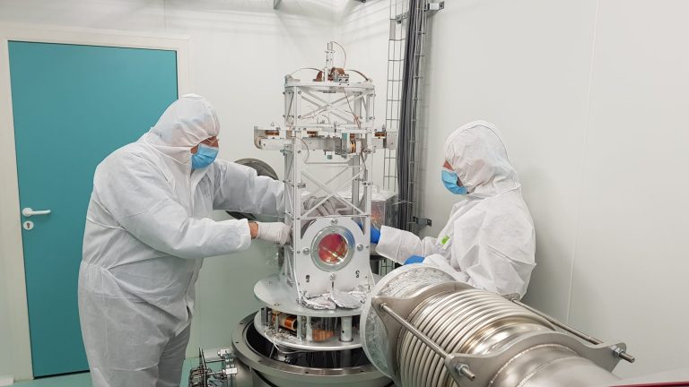 Researchers working on the mirrors of the new 300 meter optical filter cavity